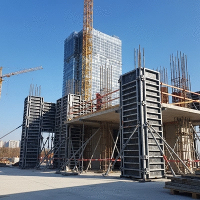 Modern construction site with aluminum formwork being assembled for a high-rise building