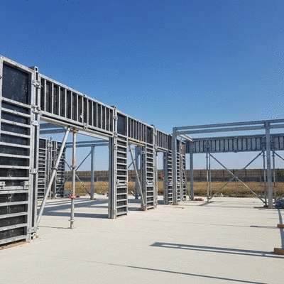 Modern construction site with aluminium formwork being assembled, clear skies, no text, no words, no typography, clean image